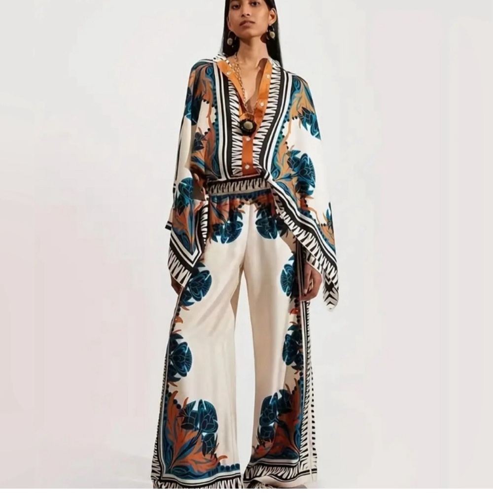 Two piece set. Pants on top of 100% polyester.